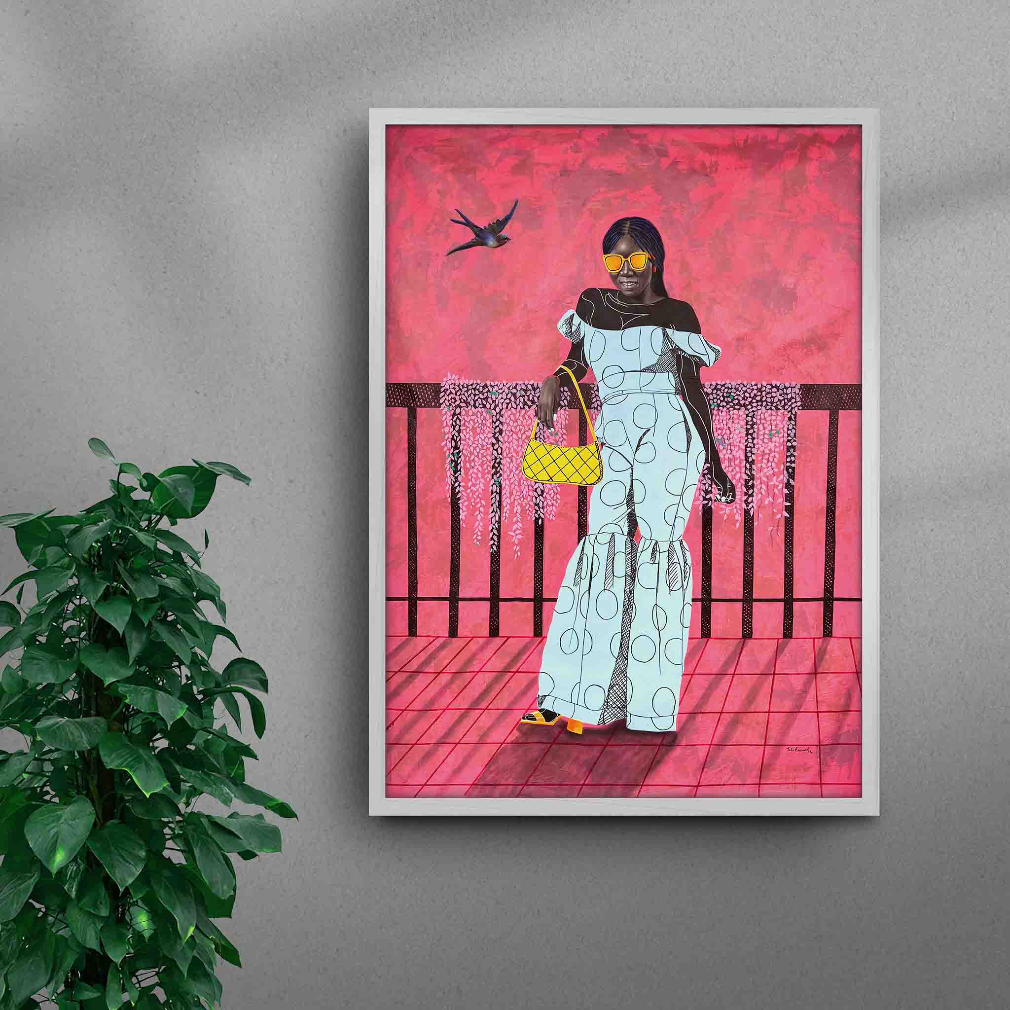 Framed A La Mode 1 black art print by Tolu Raymond, a contemporary African artwork featuring an African lady in an elegant blue outfit, set against a bold pink background with striking sunglasses and a yellow handbag, in a white frame