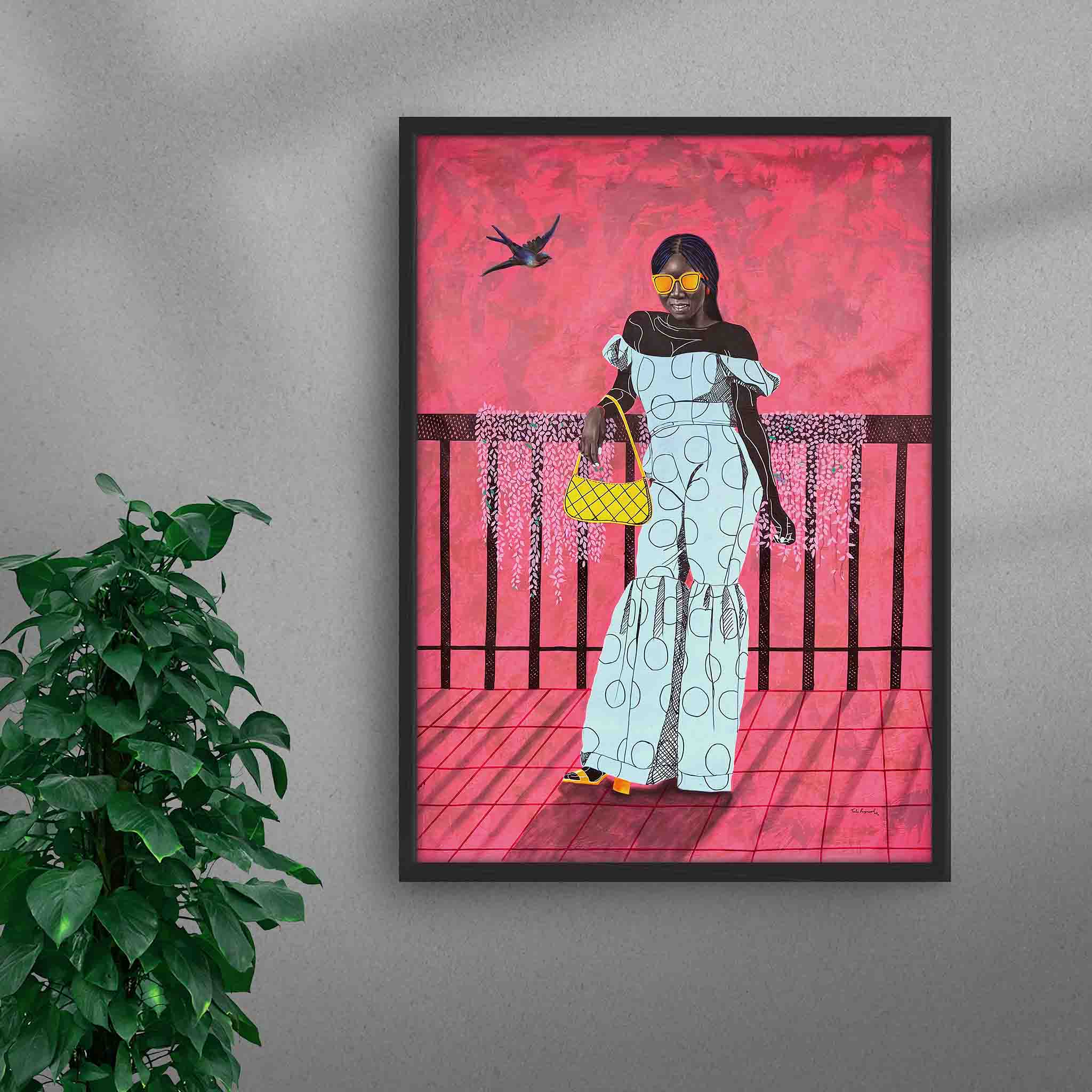 Framed A La Mode 1 black art print by Tolu Raymond, a contemporary African artwork featuring an African lady in an elegant blue outfit, set against a bold pink background with striking sunglasses and a yellow handbag, in a black frame