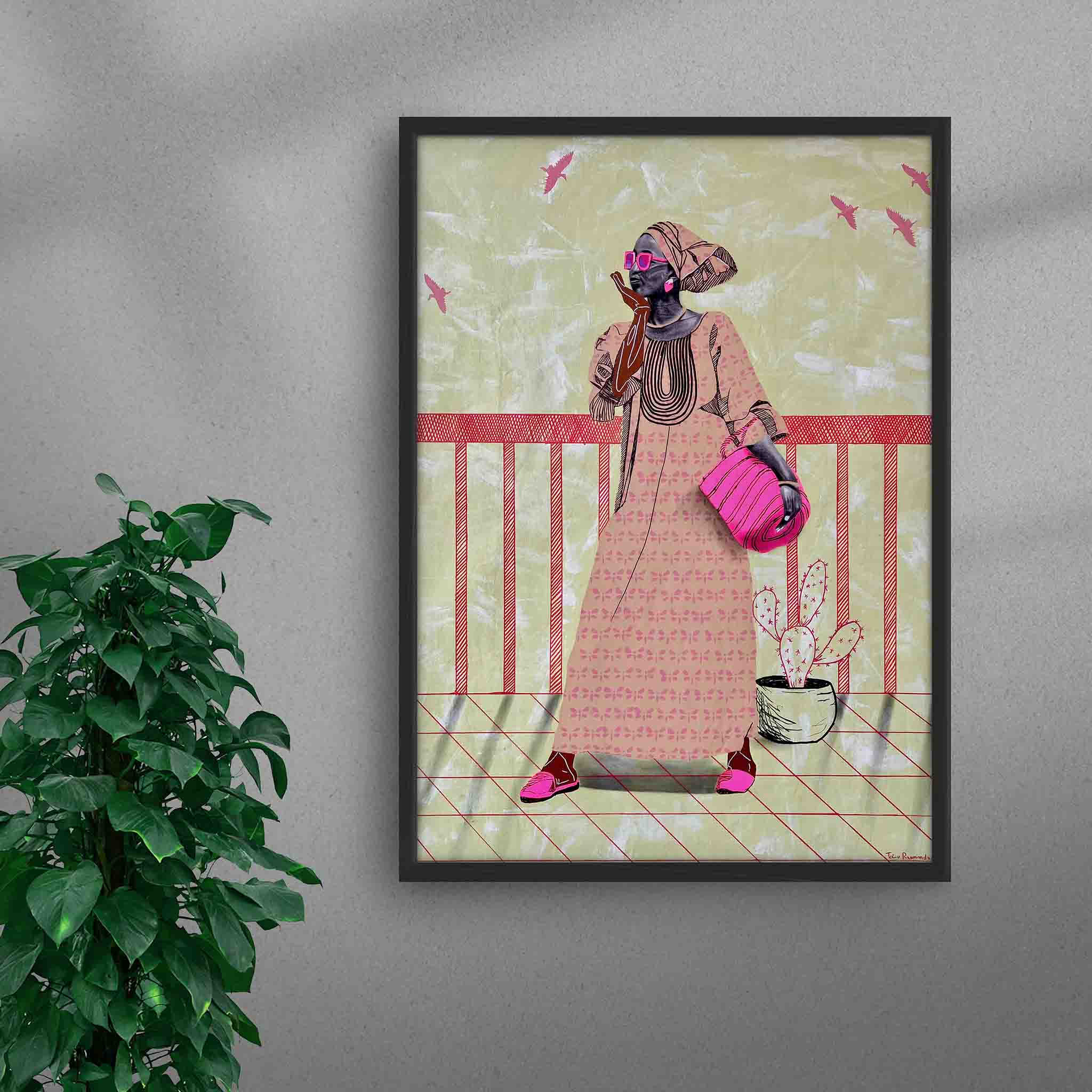 Framed A La Mode 3 black art print by Tolu Raymond, a contemporary African artwork featuring an African lady in a traditional beige dress with pink accessories, standing against a muted green background with abstract textures and red railing details, in a black frame