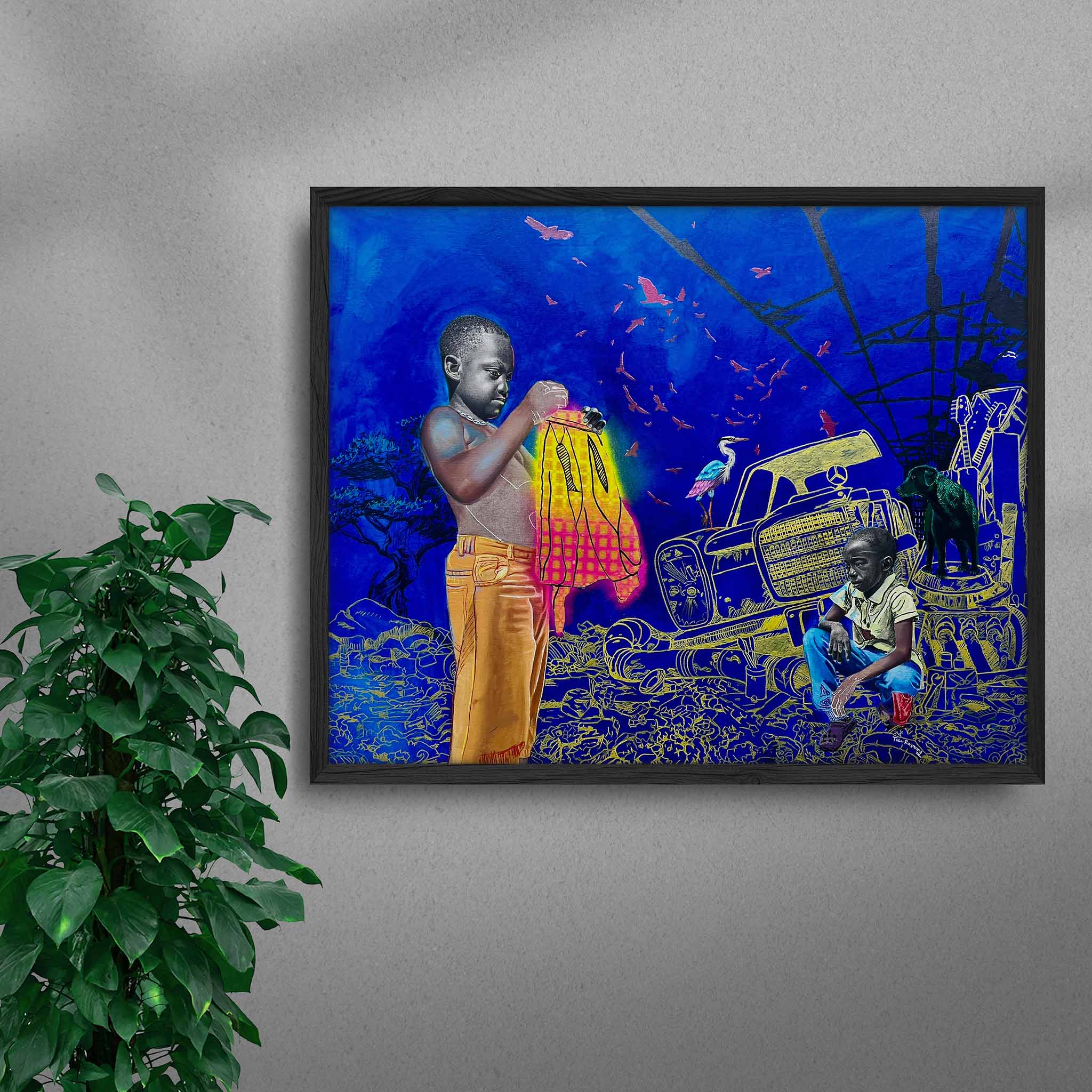 Framed Gold Mine black art print by Tolu Raymond, a contemporary African artwork featuring two young African boys in a surreal junkyard scene with a deep blue background, golden yellow mechanical elements, and a glowing red and yellow cloth, in a black frame