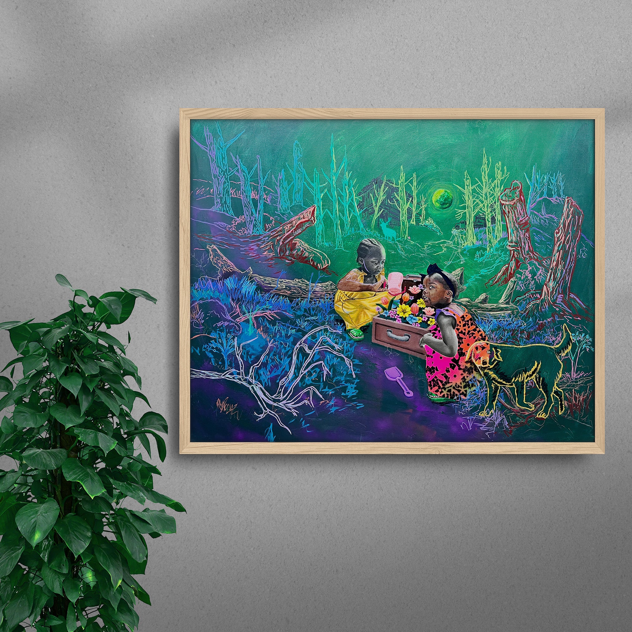 Framed Treasure Box black art print by Tolu Raymond, a contemporary African artwork featuring two young African girls playing with a suitcase full of colorful flowers in a surreal forest setting with neon green trees, a glowing green moon, and a golden-outlined dog, in a natural wood frame