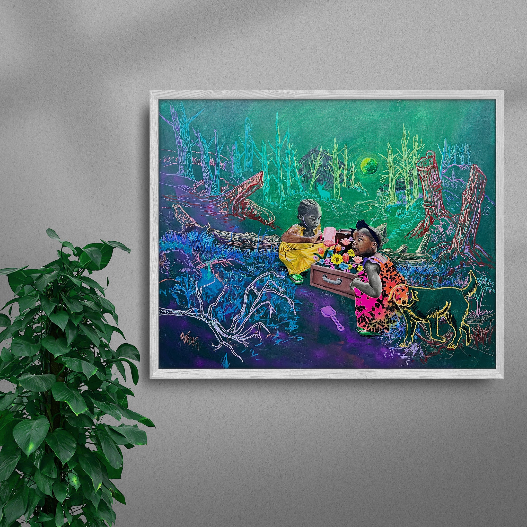 Framed Treasure Box black art print by Tolu Raymond, a contemporary African artwork featuring two young African girls playing with a suitcase full of colorful flowers in a surreal forest setting with neon green trees, a glowing green moon, and a golden-outlined dog, in a white frame